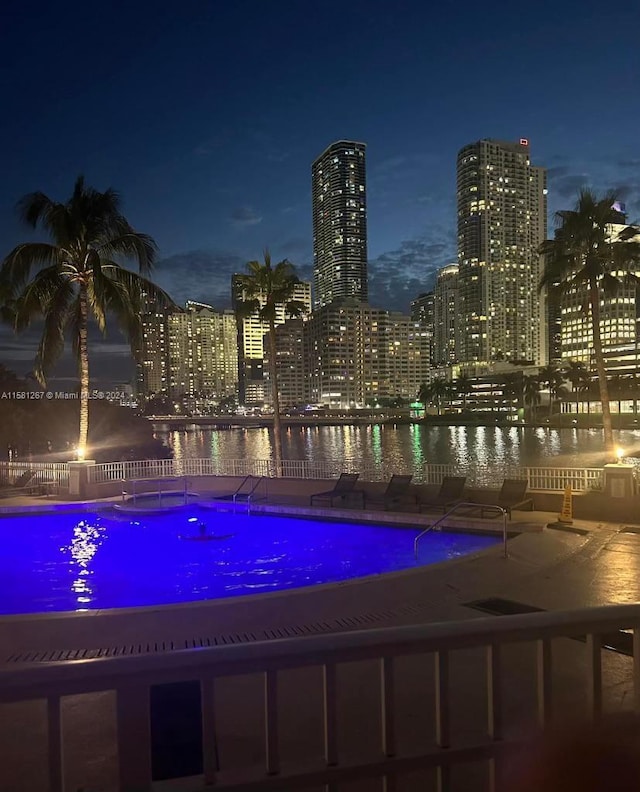 view of pool at night