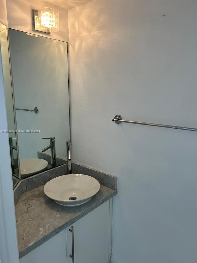 bathroom with toilet and vanity