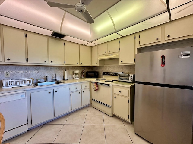 kitchen featuring ceiling fan, light tile floors, sink, white appliances, and tasteful backsplash