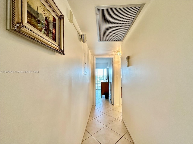 hall with light tile flooring