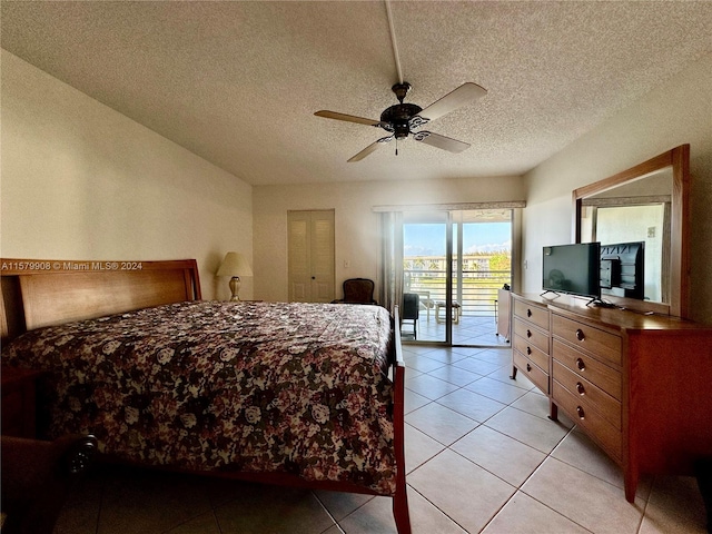 tiled bedroom featuring a closet, a textured ceiling, ceiling fan, and access to outside