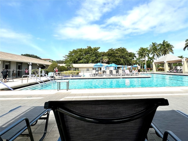 view of pool with a patio and a gazebo