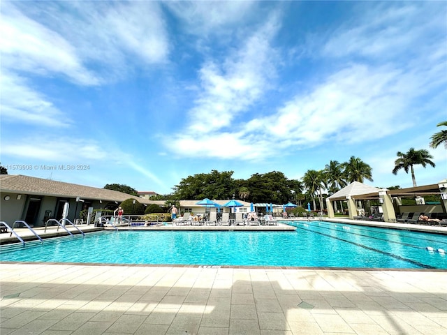 view of swimming pool featuring a patio area