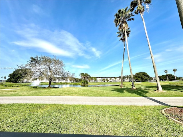 view of nearby features featuring a yard and a water view