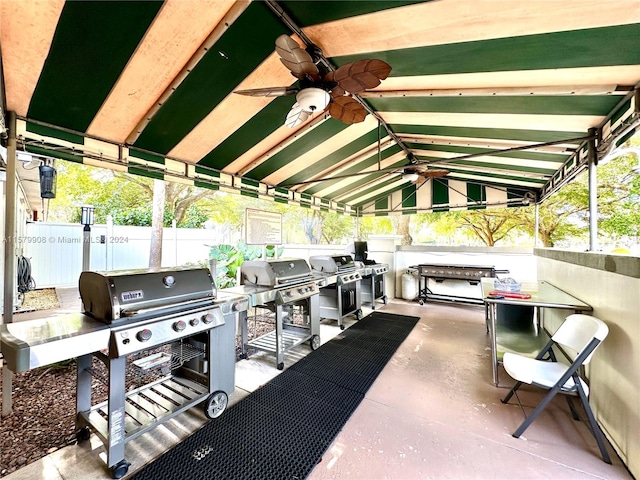 view of terrace featuring an outdoor kitchen, ceiling fan, and grilling area