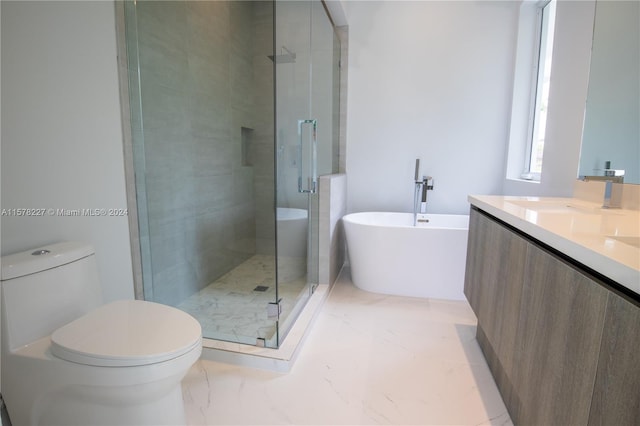 bathroom featuring tile flooring, vanity, toilet, and a shower with door