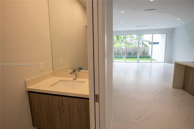 bathroom featuring oversized vanity and tile flooring