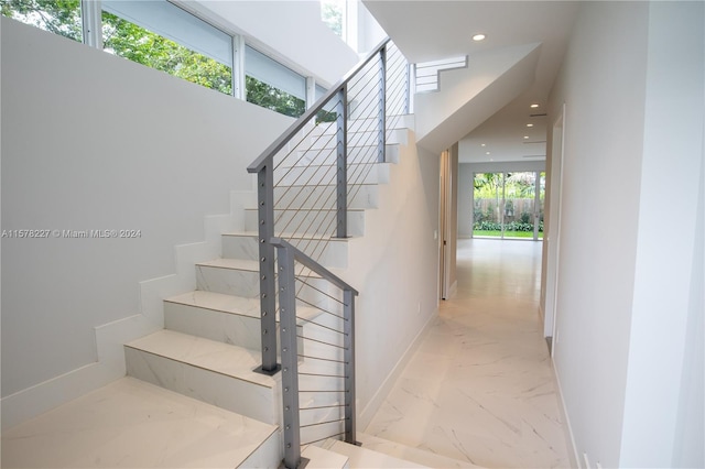 stairs with light tile flooring