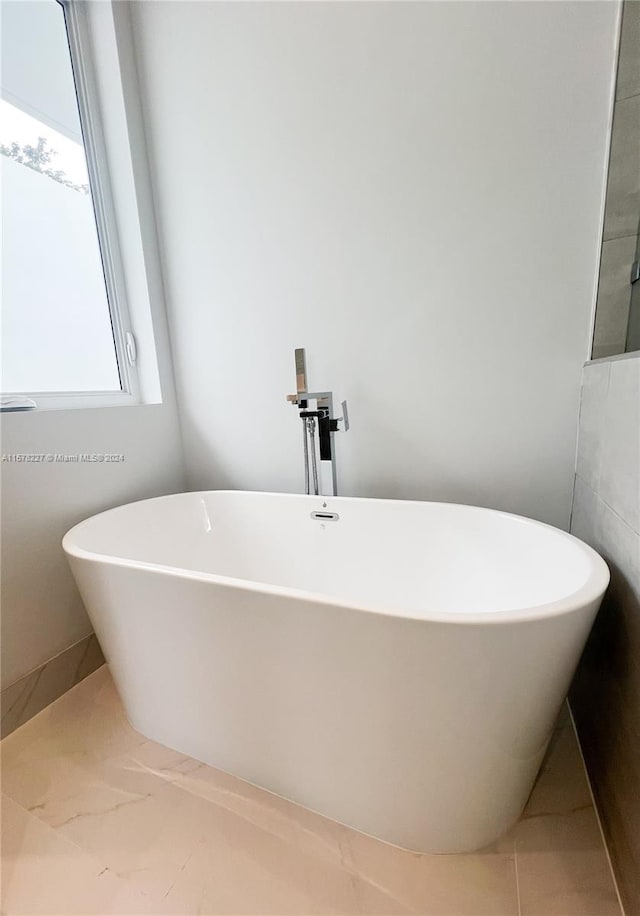 bathroom with tile floors and tile walls