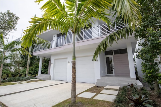 view of front of property with a balcony and a garage