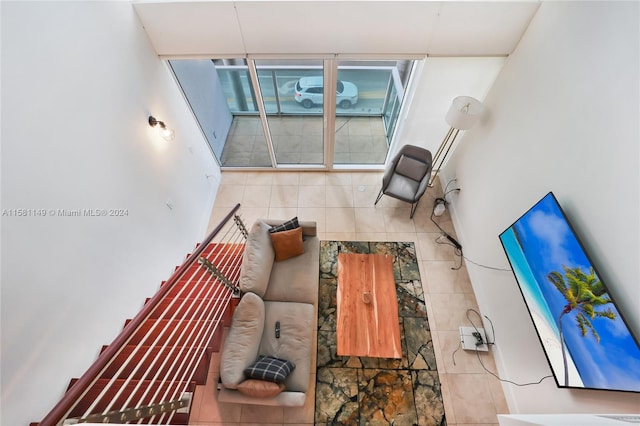 living room featuring tile walls and tile floors