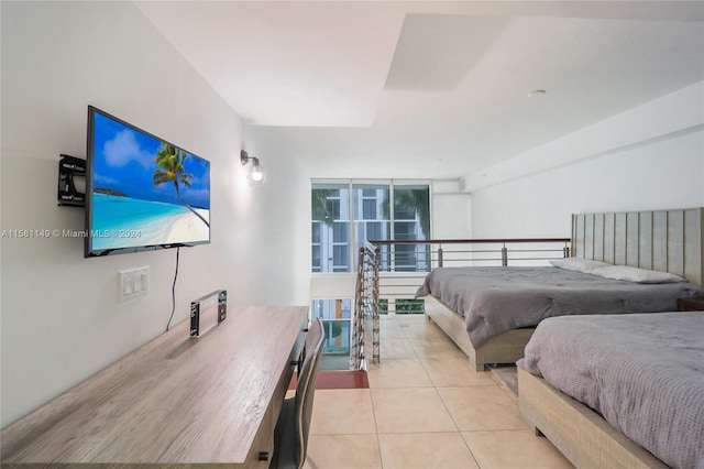 bedroom featuring light tile floors