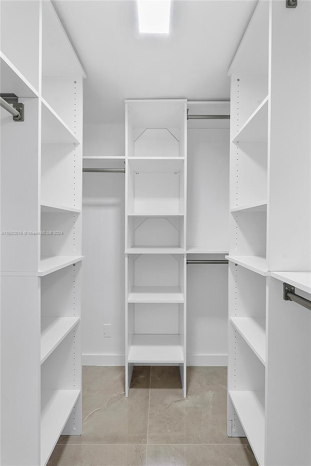 spacious closet featuring tile floors