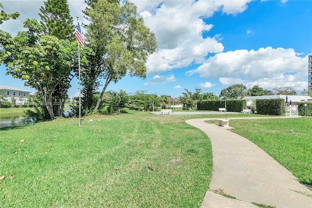 view of property's community featuring a yard