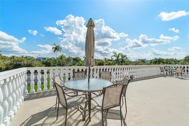 view of patio featuring a balcony