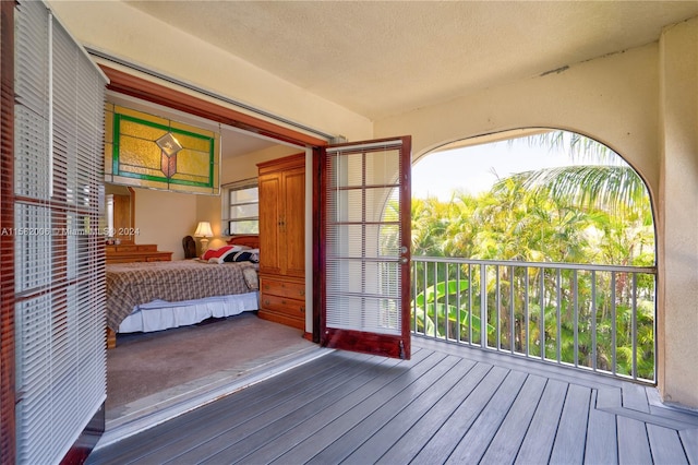 bedroom featuring a textured ceiling and hardwood / wood-style floors