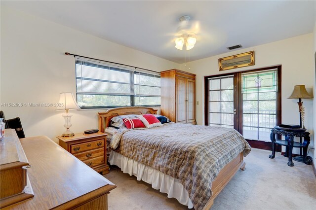 carpeted bedroom with access to outside and ceiling fan