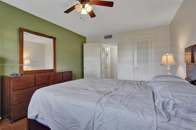 bedroom with wood-type flooring and ceiling fan