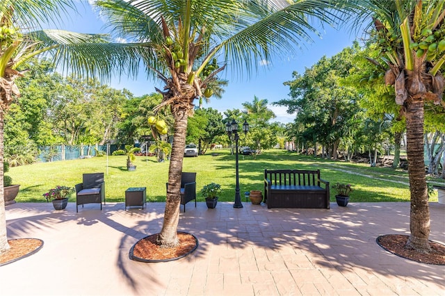 view of home's community featuring a patio and a yard