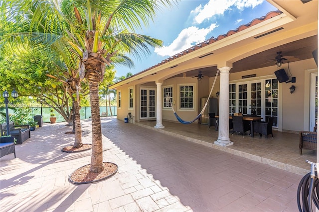 view of patio featuring ceiling fan and french doors