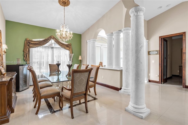 dining space featuring decorative columns, lofted ceiling, and light tile patterned floors