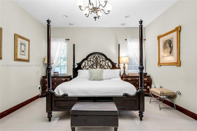 tiled bedroom with a chandelier