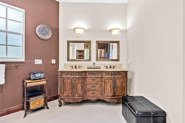 bathroom with tile patterned flooring and double sink vanity