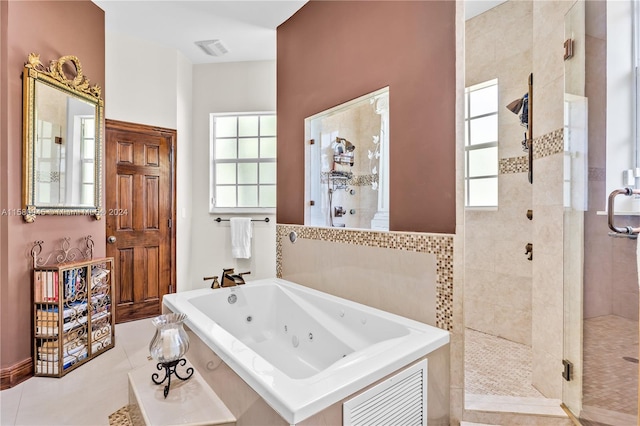 bathroom with plus walk in shower and tile patterned flooring