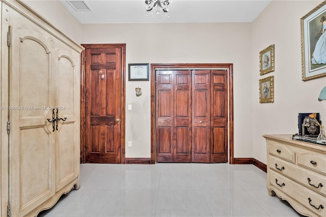 foyer entrance featuring light tile patterned flooring