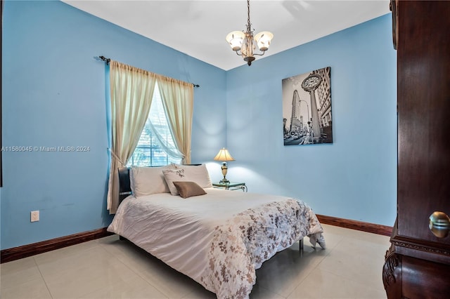 tiled bedroom with a chandelier