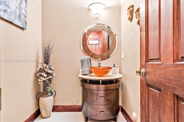 bathroom featuring tile patterned flooring and vanity