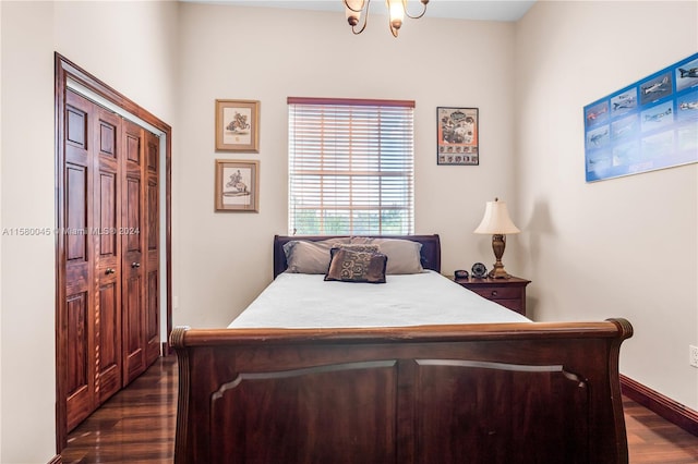 bedroom featuring a closet and dark hardwood / wood-style flooring