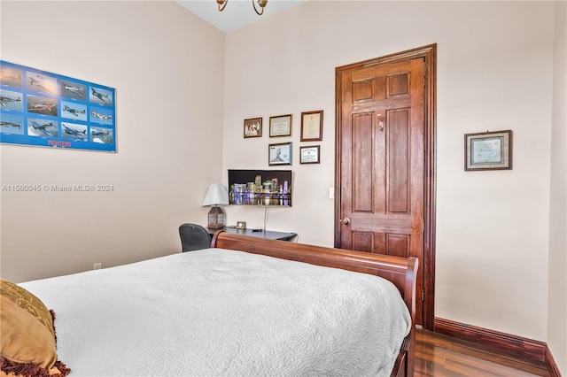 bedroom featuring dark wood-type flooring