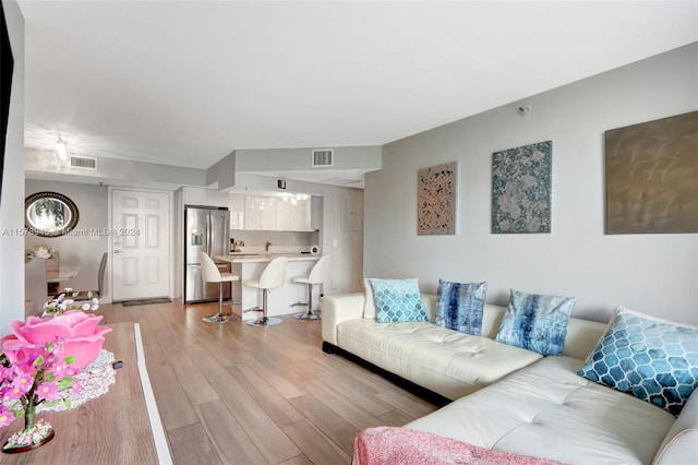 living room with light hardwood / wood-style flooring