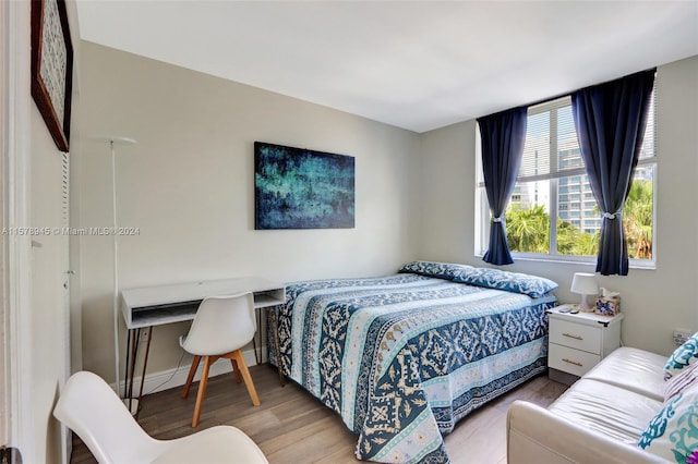 bedroom with light wood-type flooring