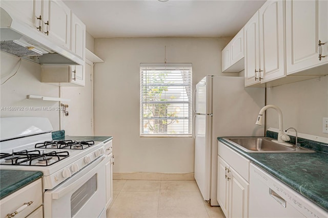 kitchen with light tile patterned floors, sink, white appliances, and white cabinetry