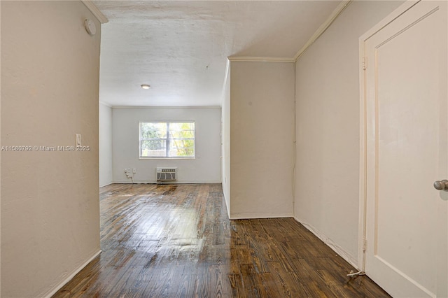 unfurnished room featuring dark hardwood / wood-style flooring and crown molding