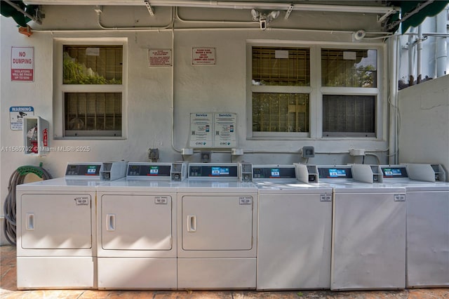 clothes washing area featuring washer and dryer