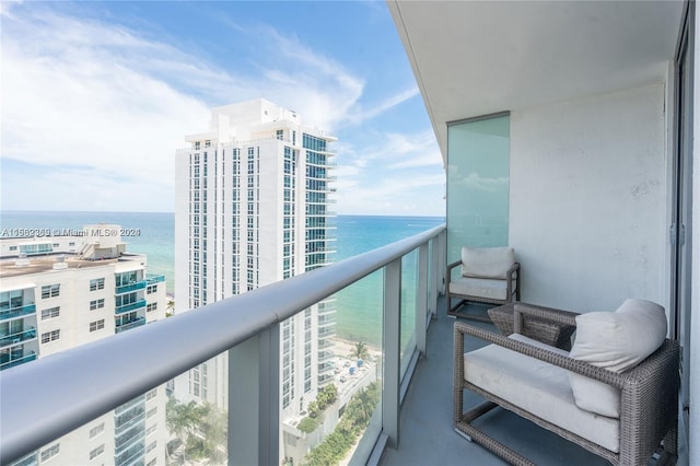 balcony featuring a water view