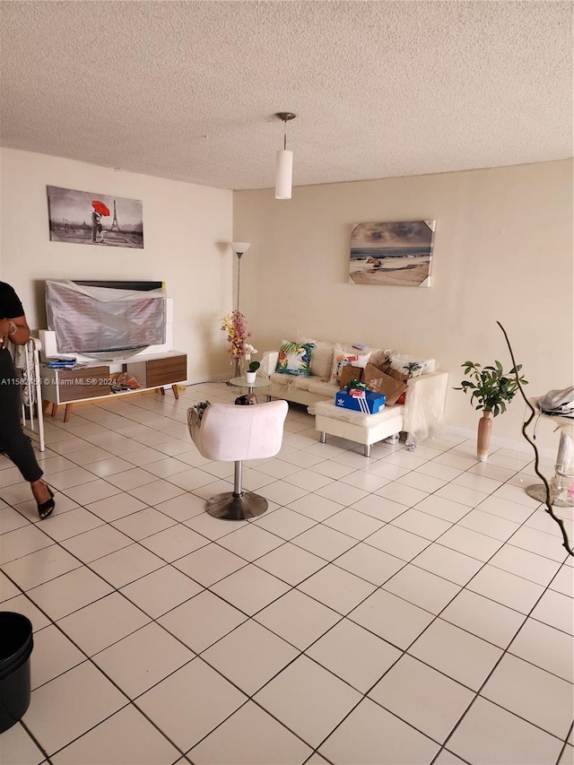 tiled living room with a textured ceiling