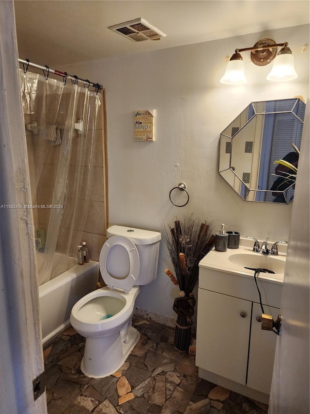 full bathroom with shower / tub combo, toilet, tile flooring, and vanity