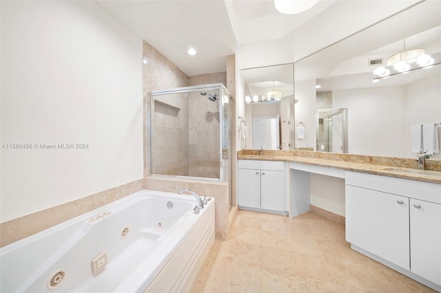 bathroom with plus walk in shower, oversized vanity, double sink, and tile flooring