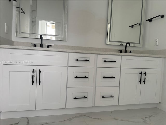 bathroom with tile flooring and vanity