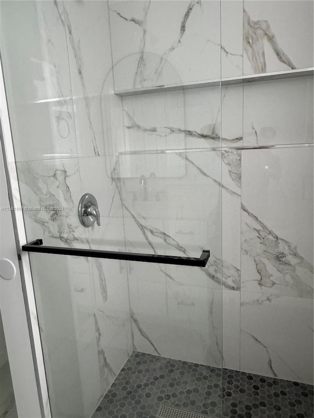 room details featuring a shower with shower door