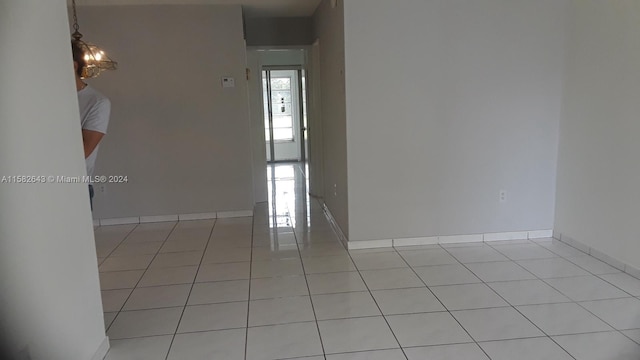 empty room with plenty of natural light and light tile floors