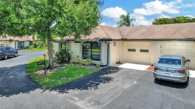 ranch-style home with a garage