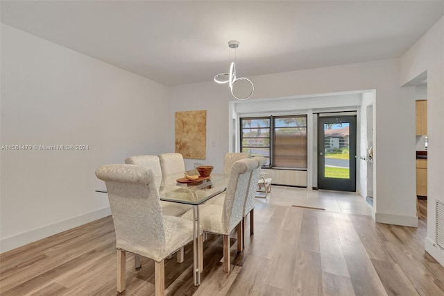 dining area with light hardwood / wood-style floors