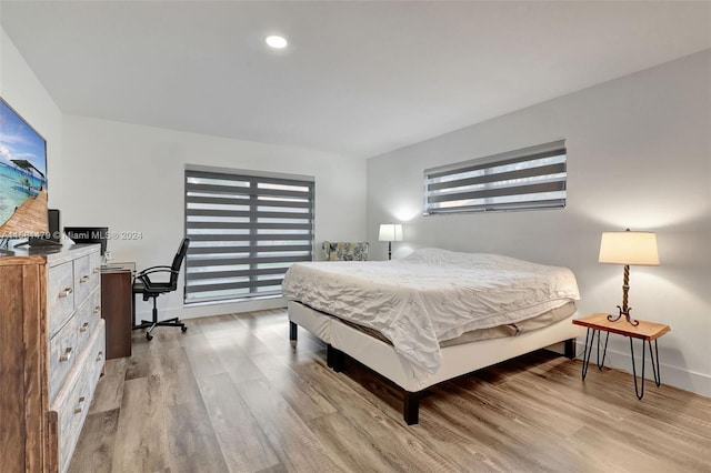 bedroom with hardwood / wood-style floors