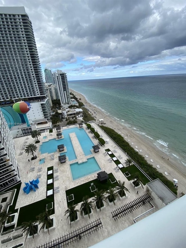 bird's eye view featuring a beach view and a water view