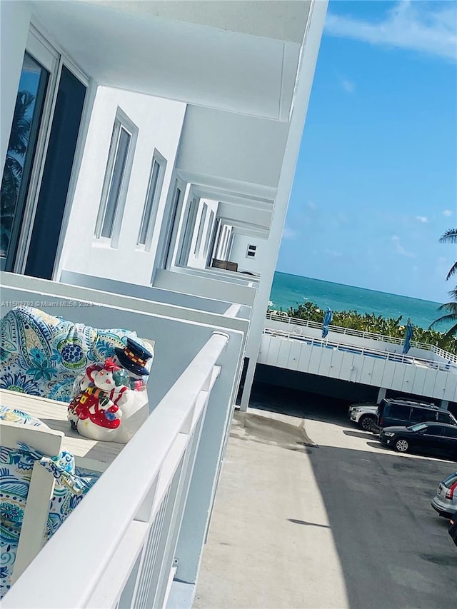 balcony featuring a water view